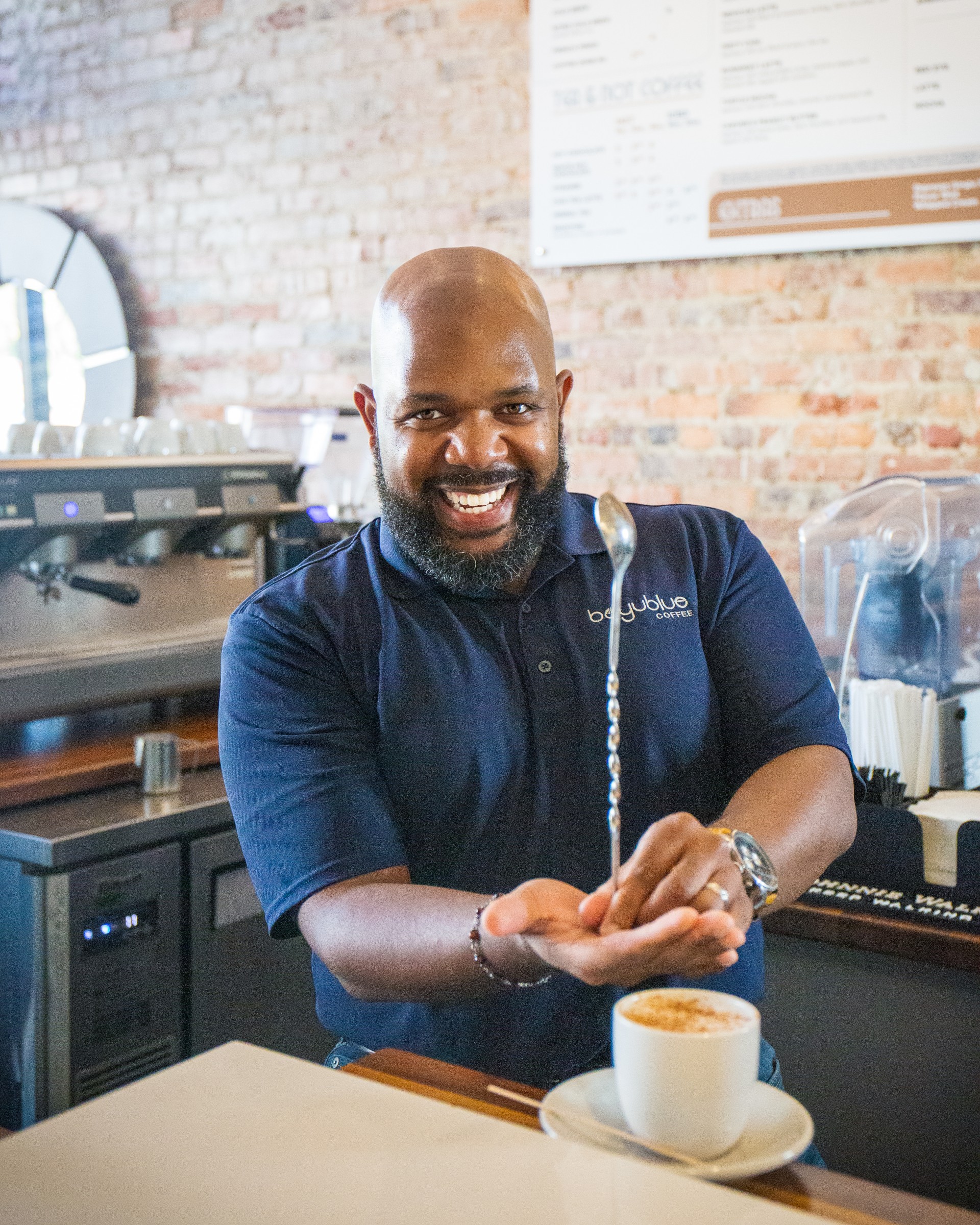 Dorian Bolden behind a coffee bar.