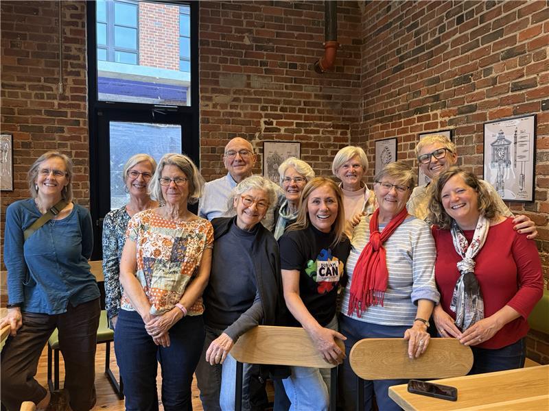Volunteers smile for a picture together in Durham.
